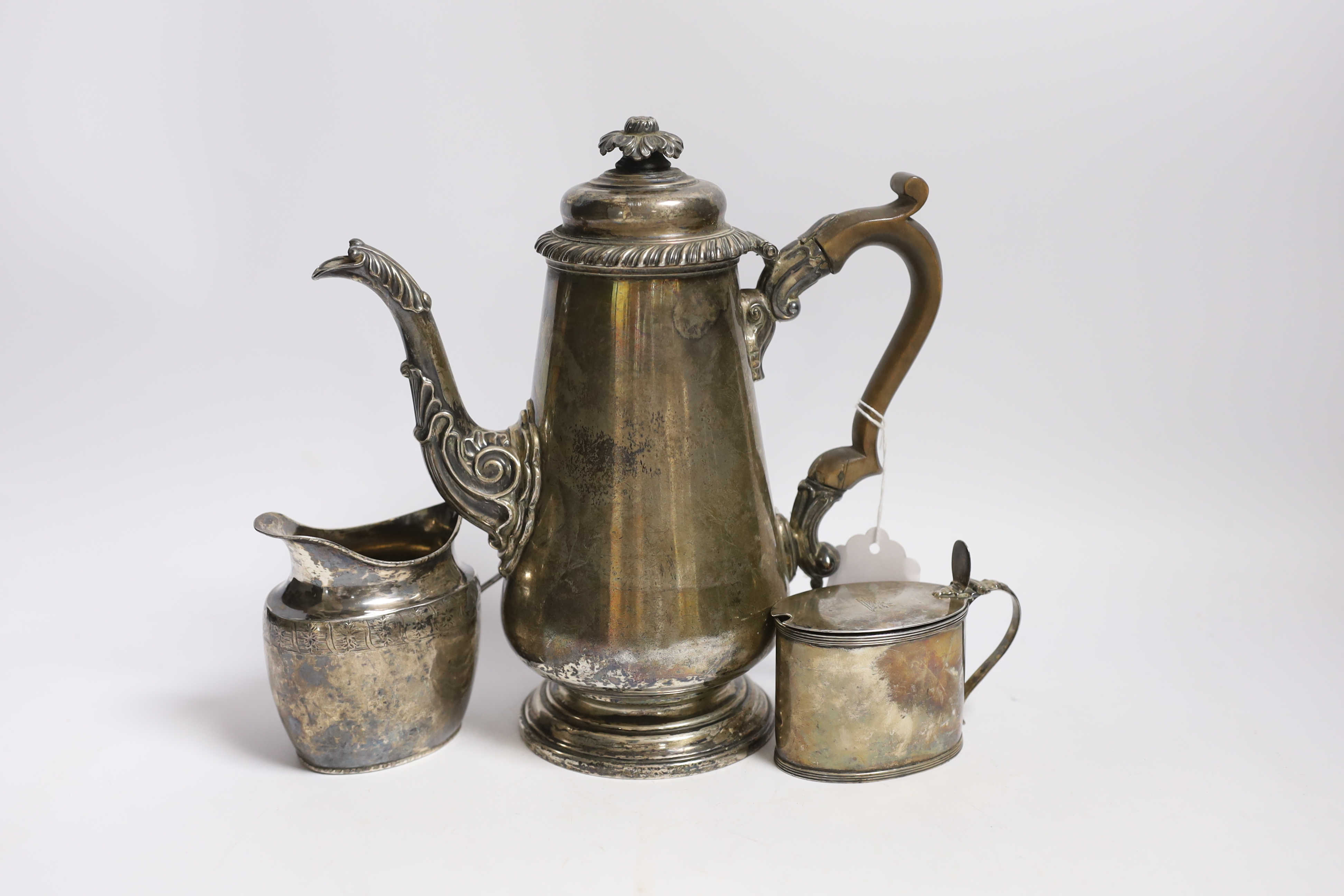 A George IV silver coffee pot, by S.C. Younge & Co, Sheffield, 1821, height 24.5cm, together with a Georgian silver cream jug (a.f.) and a George III silver oval mustard pot by Peter & Ann Bateman, London, 1799, gross we